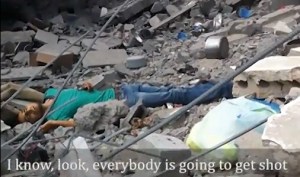 A YouTube screen cap of a man shot by an Israeli sniper while hunting through rubble for his family.
