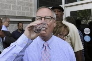 Toledo Mayor D. Michael Collins proudly takes a swig of fresh, wholesome Toledo water.