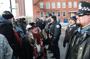 Protesters square off with police outside Homan Square. Photo from the Chicago Tribune.