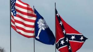 The U.S. flag, the South Carolina state flag, and the Confederate Flag all fly over the South Carolina's capitol building.