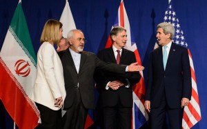 Iranian Foreign Minister Mohammad Javad Zarif, second-left, stands on stage with diplomats in Switzerland, including US Secretary of State John Kerry, far right.