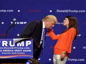 A woman pulls Donald Trump's hair at an event to prove it's real. This passes for 