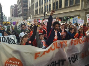 Students, faculty and low-wage workers march in solidarity in downtown Chicago.